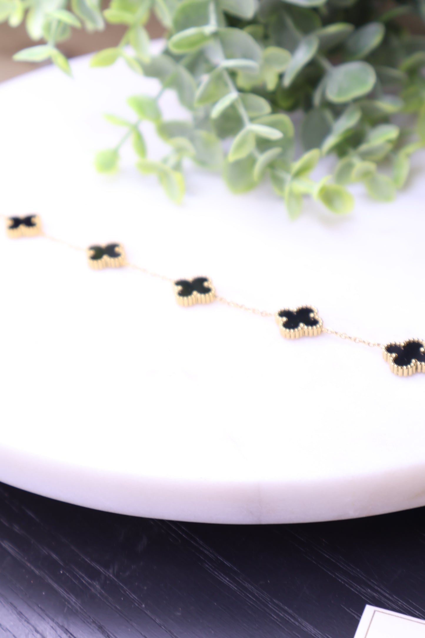 Lucky Luxe: Black & Gold Clover Bracelet