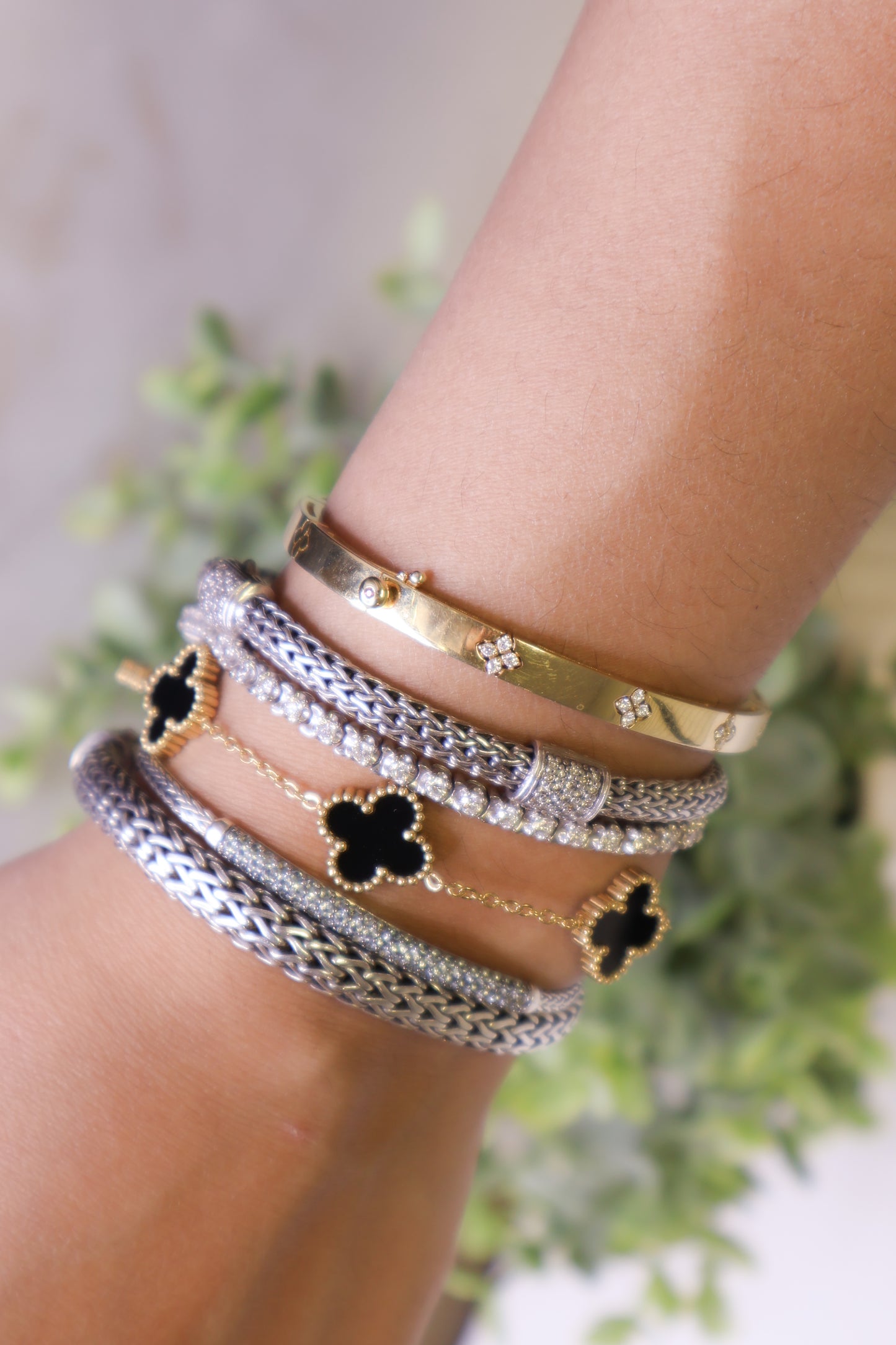 Lucky Luxe: Black & Gold Clover Bracelet