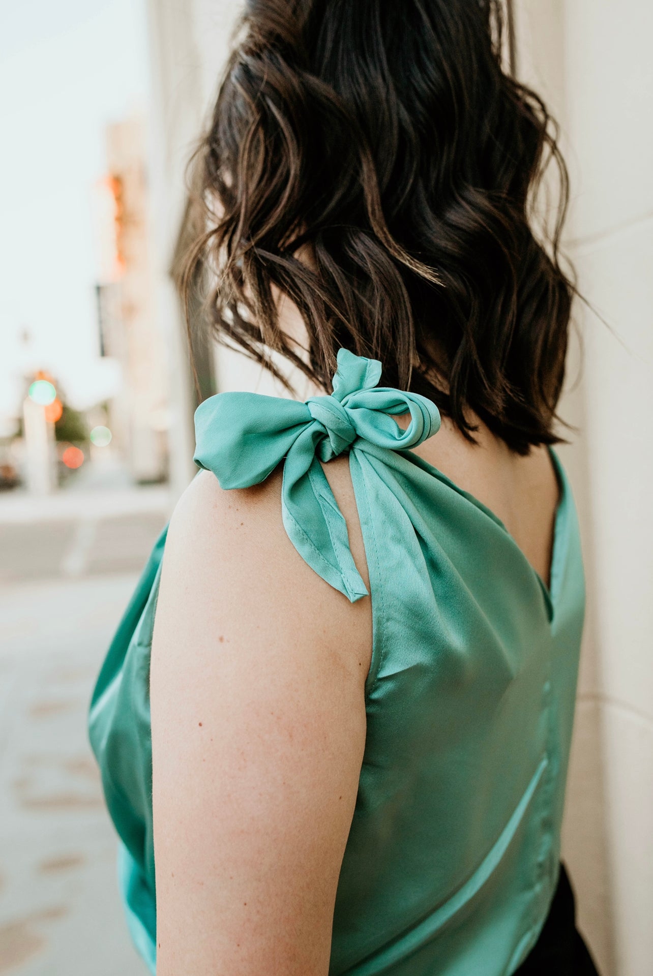 Lindsay Turquoise Satin V-Neck Sleeveless Bodysuit adjustable straps close up