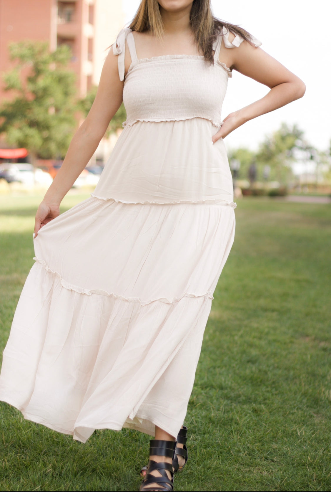 The sweet cream color is such a staple for the new season. It also features a maxi length, smocked bodice, and tiered layers.