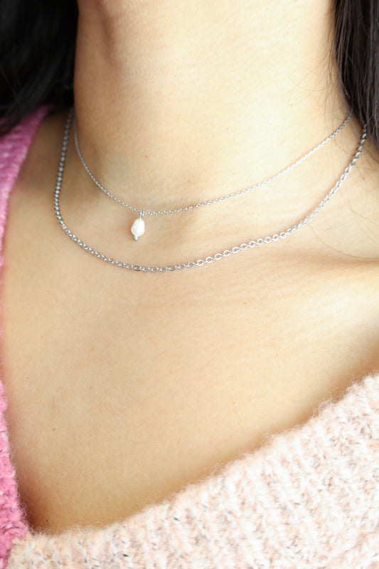 Floating pearl necklace on model